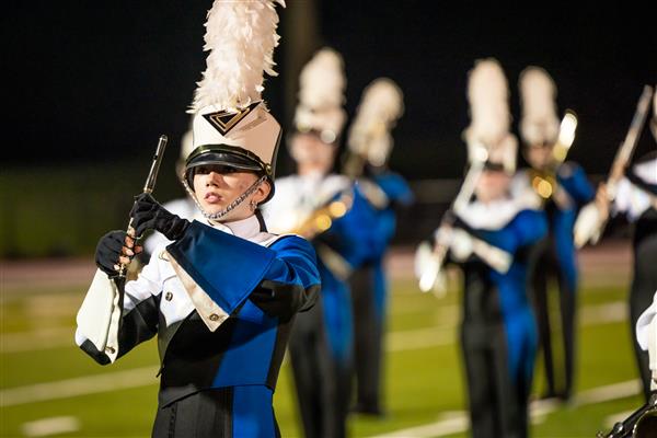 Brentwood High band members play on the football field